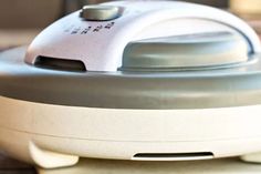 a close up view of an electronic device on a table with the lid open and buttons visible