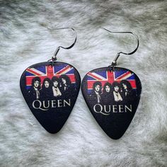 -Queen guitar pick earrings -Hypoallergenic metal      *925 Sterling Silver -Super lightweight!  You won't even feel them in -Great to send as a gift! I ship them nicely packaged and in a cute decorative envelope.       *Please indicate it is a gift when ordering so packing slip/price is not included. Custom Guitar Pick, Engraved Guitar Pick, Guitar Pick Earrings, Personalised Guitar Pick, Guitar Pick + Necklace Cheap, Queen Gifts, Queen Freddie Mercury, Freddie Mercury, Guitar Pick