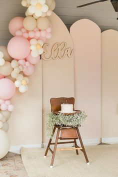 a baby's first birthday party with balloons and decorations