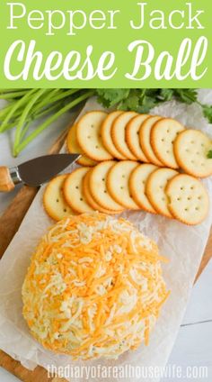 a cheese ball with crackers and celery on the side next to it