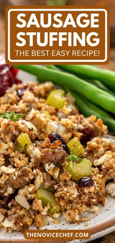 sausage stuffing on a white plate with green beans and cranberries in the background