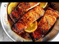 fish with lemons and parsley in a pan