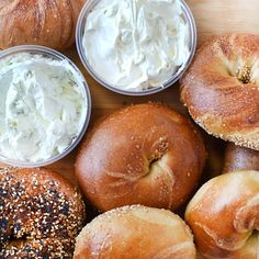 bagels and cream cheese on a cutting board