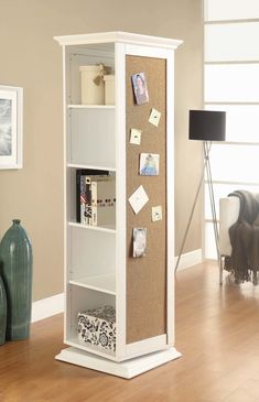 a white book case with cork and memos on it