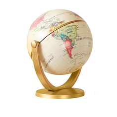 a white and gold globe on a stand