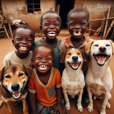 a group of children and dogs smiling for the camera