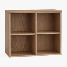 an empty wooden shelf with three compartments