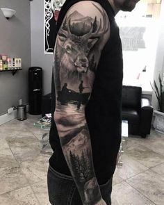 a man with a deer tattoo on his arm