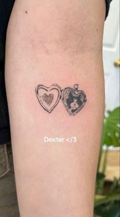 a couple of hearts tattoo on the arm