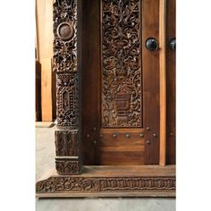 an ornate carved wooden door on display