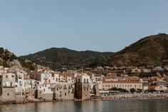 an old town on the edge of a body of water