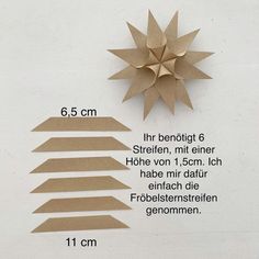 an origami star is shown with measurements for the size and shape on it