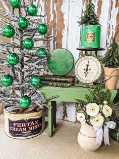 a green christmas tree sitting on top of a table