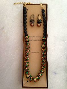 a necklace and earring set in a box