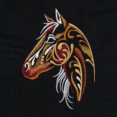 an embroidered horse head on a black background