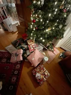 a christmas tree with presents under it