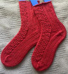 This listing is for a pair of Ruby Red Cable Lace Rib Socks. Spin2Knit artisan-made hand knit socks:  - exceptionally comfortable, warm, and wear well.  - hand knit by me with care and precision right here in my studio. - SLOW-MADE fashion... taking about 45 hours of hand knitting. Socks make great GIFTS!  - Everyone enjoys a cozy, warm pair of socks!  - One of the most practical accessories that everyone needs. - An excellent gift for someone who appreciates natural materials and the uniqueness of a handmade item. - Hand knit socks keep your feet nice and warm yet still allow air circulation. ::SIZE::  Foot length: 8.5 to 10.5 inches comfortably Leg from top leg edge down to heel: 8 inches Wool stretches a bit and will conform to your foot as you wear it. ::YARN:: These socks are made fro Handknit Socks, Practical Accessories, Fashion Movement, Red Socks, Hand Knit Socks, Air Circulation, Red Lace, Socks And Hosiery, Knit Socks