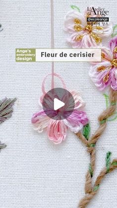 the video shows how to make flowers with yarn