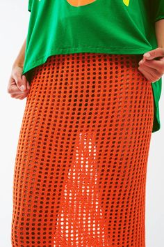 Make a statement with our Maxi Sheer Crochet Skirt in Orange. This stunning skirt is crafted from a blend of 45% viscose, 35% polyamide, and 20% acrylic, offering a comfortable and breathable fit. The bodycon fit and high waist rise enhance your curves and create a flattering silhouette. The midi length adds an elegant touch, while the sheer crochet design exudes boho vibes. The elastic waist ensures a secure and comfortable fit. Our model, with measurements 31-24-35 and a height of 5'10", is we Spring Mesh Mini Skirt, Spring Knit Mini Skirt, Knit Mini Skirt For Spring, Summer Stretch Mesh Skirt, Long Mesh Skirt For Spring, Spring Long Mesh Skirt, Crochet Mini Skirt For Summer, Summer Stretch Pointelle Knit Bottoms, Summer Mesh Mini Skirt