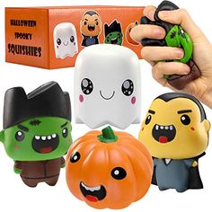 a hand holding a toy with halloween decorations on it