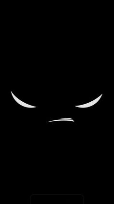 an image of a black background with white eyes and the word,'batman'written on it