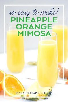 three glasses filled with orange mimosa on top of a white table next to sliced oranges