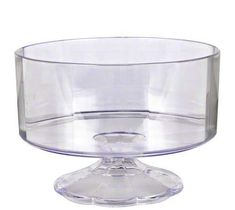 a clear glass bowl sitting on top of a table