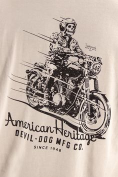 an american heritage t - shirt with a man on a motorcycle