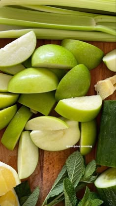 green apples and cucumbers on a cutting board