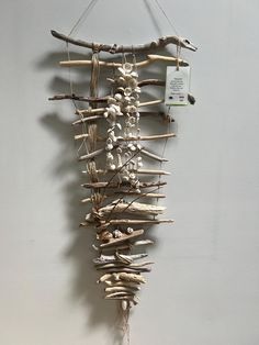 a wall hanging made out of branches and twigs