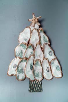 a christmas tree made out of porcelain dishes