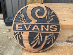 a wooden sign that says evans on it