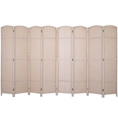 a white room divider with four panels