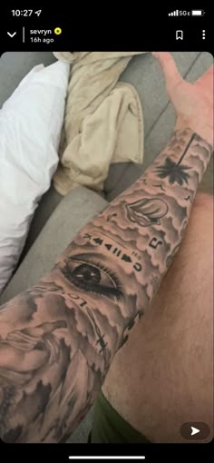 a man's arm with tattoos on it