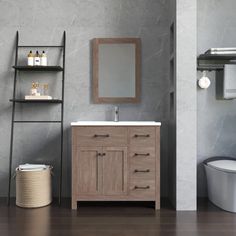 a bathroom with a toilet, sink and shelving unit in grey marbled wood