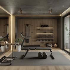 a gym with exercise equipment and mirrors in the wall, along with wooden flooring