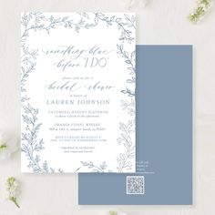 a blue and white wedding card with flowers