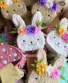 some paper bunnies are decorated with flowers and bunny ears