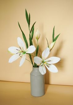 there is a vase with flowers in it on the table