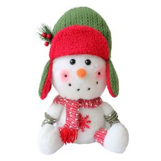 a snowman stuffed animal wearing a red and green hat with pom - poms