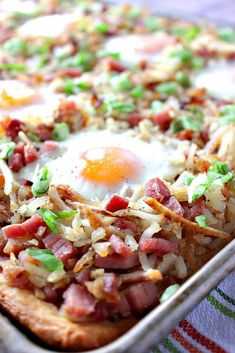 an egg is on top of rice in a pan