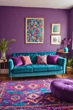 a living room with purple walls and blue couch in the center, colorful rug on the floor