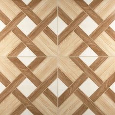 a wooden floor with white and brown tiles on it's sides, as well as an image of a diamond pattern