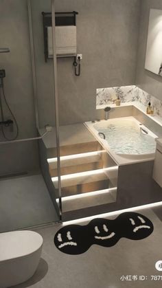 a bathroom with a sink, toilet and bathtub next to a walk in shower