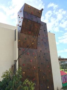 the climbing wall is made out of wood and metal