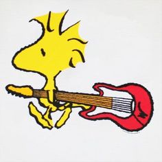 a sticker with a cartoon dog holding a guitar in it's right hand