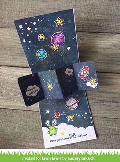 two small cards with space themed stickers on them