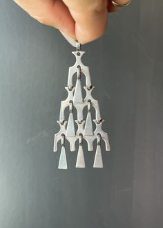 "* Vintage Norwegian handmade modernist style sterling silver dangling ships pendant. * Stamped \"David-Andersen\", \"Norway Sterling\", and \"925S\" * Measurements- 3 inches long x 1.4 inches wide at the widest point    Bail- 0.2 inch  * Weight- 12.3 grams  Please view and inspect the photos closely, as they are considered part of the condition. I endeavor to fully disclose all condition information clearly, however, please note that what qualifies as excellent condition for historical jewelry, and collectibles differs from modern and contemporary pieces. Minor age wear is typical and to be expected for antique and vintage jewelry. All items are unpolished and in their vintage condition, items can easily be polished up if so desired.  Enjoy,  Dev" Vintage Modern Scandinavian Necklace, Danish Jewelry, Modernist Silver Jewelry, Contemporary Handmade Jewelry, Vintage Modern Jewelry, Contemporary Jewelry Design, Trendy Nail Art Designs, Historical Jewellery