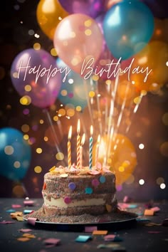 a birthday cake with lit candles surrounded by confetti and balloons