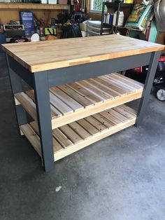 a kitchen island made out of wood and metal